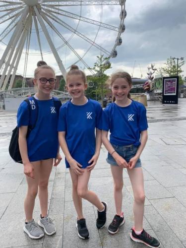 Gymnasts in front of Wheel of Liverpool